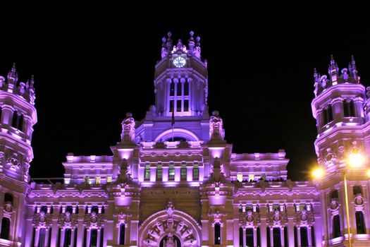 Beautiful City Hall of Madrid illuminated in purple in the International Women's Day