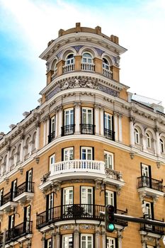 Old colorful and beautiful facades with vintage streetlight in Madrid streets in Spring.