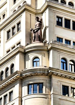 Old colorful and beautiful facades with vintage streetlight in Madrid streets in Spring.