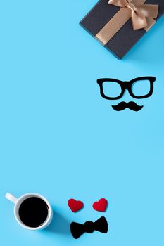 Father's day background design concept. Top view of color paper decoration layout ideas with gift box on blue table background with copy space.