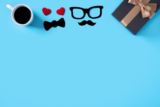 Father's day background design concept. Top view of color paper decoration layout ideas with gift box on blue table background with copy space.