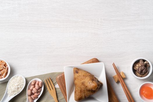 Zongzi. Delicious traditional rice dumpling food for Dragon Boat Duanwu Festival over wooden table background top view.