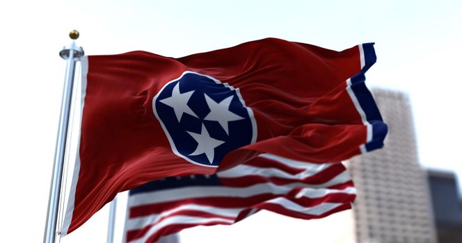 The flags of the Tennessee state and United States of America waving in the wind. Democracy and independence. American state.