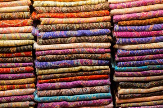 Pile of bright Multi-colored pieces of fabric in a bazaar