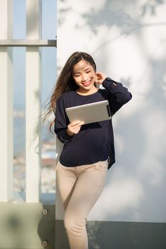 Young beautiful Asian woman working with laptop/internet/online shopping at outdoor park, smile/fresh and happy relaxing feeling in the morning, freelancer working businesswoman lifestyle concept