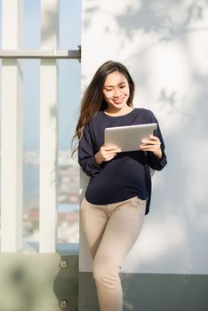 Young beautiful Asian woman working with laptop/internet/online shopping at outdoor park, smile/fresh and happy relaxing feeling in the morning, freelancer working businesswoman lifestyle concept