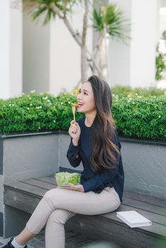 Beautiful healthy woman eating salad, Dieting Concept. Healthy Lifestyle.