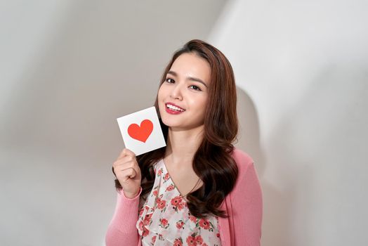 Young romantic girl with Valentines card