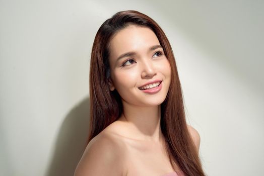 Beauty asian girl with long and shiny hair . Beautiful model woman with long hairstyle. Care and beauty