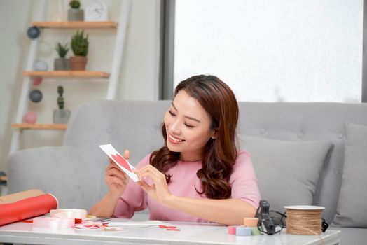 Valentine day theme. Beautiful romantic woman making present for her couple