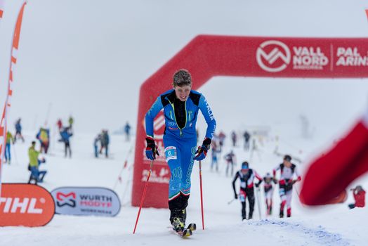VALLNORD, ARINSAL, ANDORRA - JAUNARY 26, 2020:  The Skieer BOSCACCI MICHELE (ita)climbs on skis on VALLNORD . Individual COMAPEDROSA 2020 race ski mountaineering ISMF WORLD CUP 2020 Skier climbs on skis on VALLNORD . Individual COMAPEDROSA 2020 race ski mountaineering ISMF WORLD CUP 2020