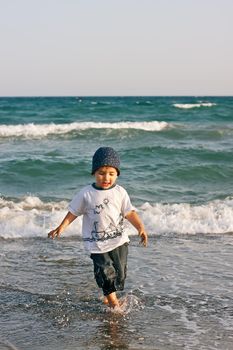 Boy walks on the beach