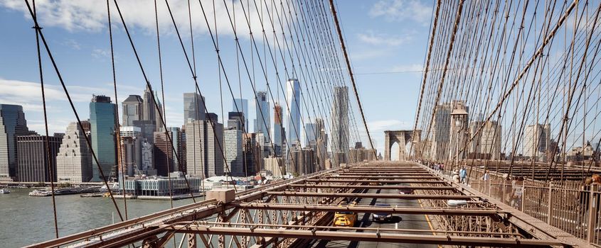 NEW YORK, USA - Sep 22, 2017: Brooklyn Bridge in New York City. Brooklyn Bridge is a hybrid cable-stayed suspension bridge in NYC and is one of the oldest roadway bridges in the United States