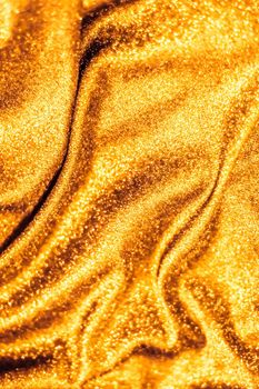 Luxe glowing texture, night club branding and New Years party concept - Golden holiday sparkling glitter abstract background, luxury shiny fabric material for glamour design and festive invitation