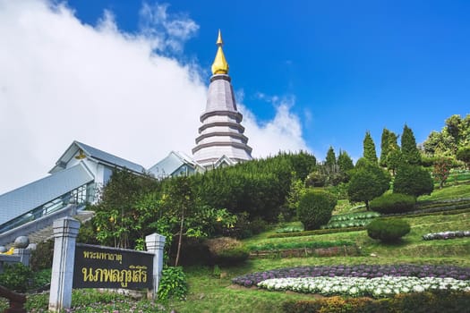 The Great Holy Relics Napaphol Bhumisiri pagoda with Thai name sign in Chiang Mai, Thailand. (Translation:Napaphol Bhumisiri pagoda)