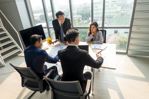 Shot of a group of businesspeople having a discussion in an office 