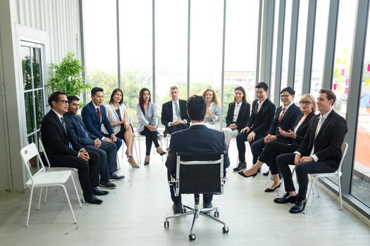 Shot of a group of businesspeople having a discussion in an office 