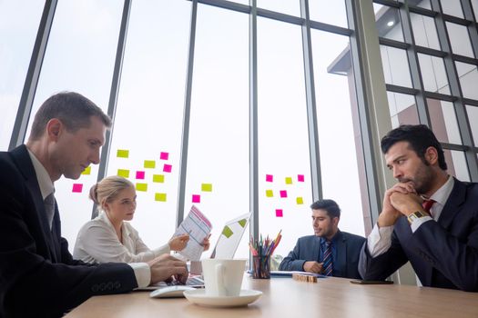 Shot of a group of businesspeople having a discussion in an office 