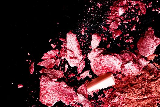 Crushed cosmetics, mineral organic eyeshadow, blush and cosmetic powder isolated on black background, makeup and beauty banner, flatlay design.