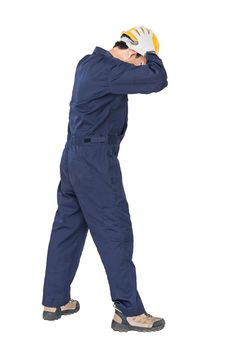 Portrait of a workman with blue coveralls and hardhat in a uniform on white background with clipping path