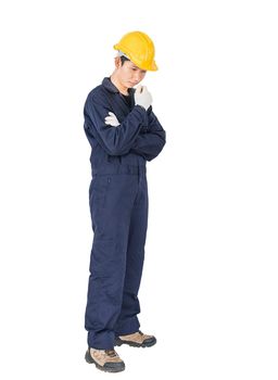 Portrait of a workman with blue coveralls and hardhat in a uniform on white background with clipping path
