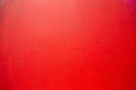 Red wall. Old house facade wall painted in red. Old English house facade