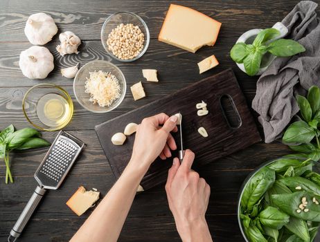 Italian Cuisine. Step by step cooking italian pesto sauce. Step 4 - cutting garlic