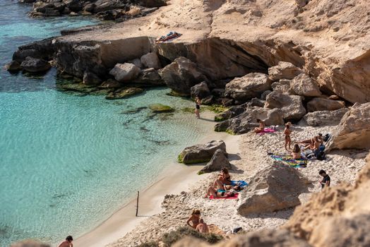 Formentera, Spain : 2021 June 04 : Young people in Formentera beach of Calo d es Mort in Balearic Islands in summer 2021