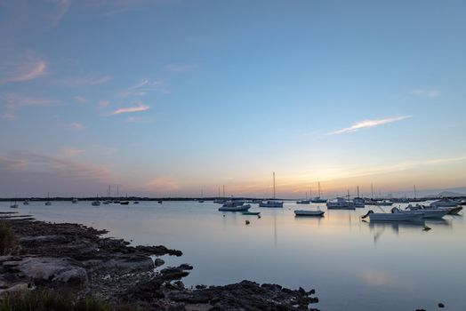 Sunset in the Estany d Es Peix in Formentera, Spain.
