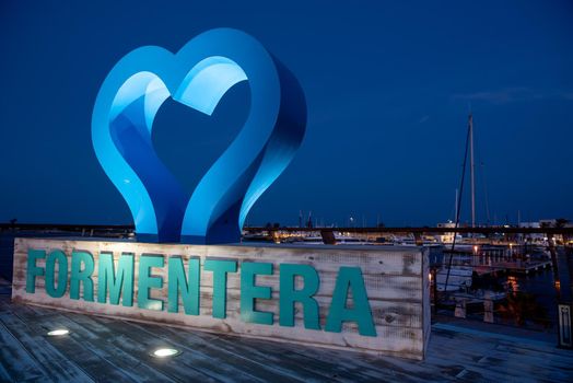 Formentera, Spain: 2021 May 26: Photocall with a night view of the port of La Savina in Formentera summer 2021.