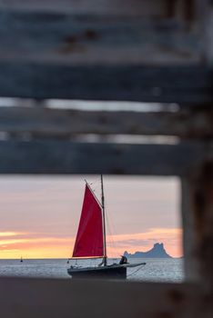 Sailing boat on the Island of Formentera in the summer of 2021 with Es Vedra behind.