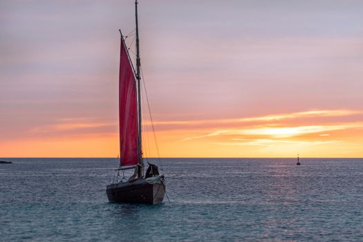 Sailing boat on the Island of Formentera in the summer of 2021 with Es Vedra behind.