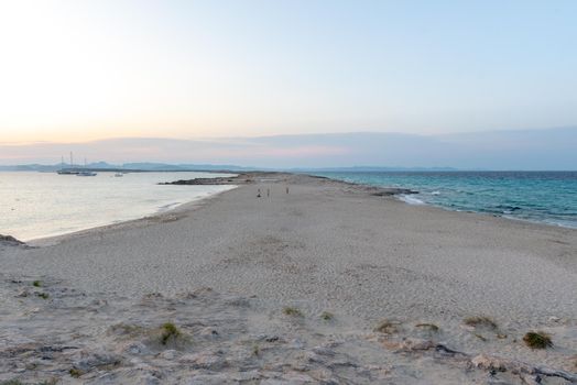 Wonderful sunset on the deserted beach of Ses Illetes on the Island of Formentera in Spain.