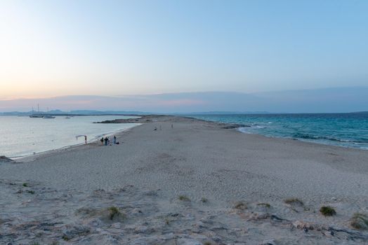 Wonderful sunset on the deserted beach of Ses Illetes on the Island of Formentera in Spain.