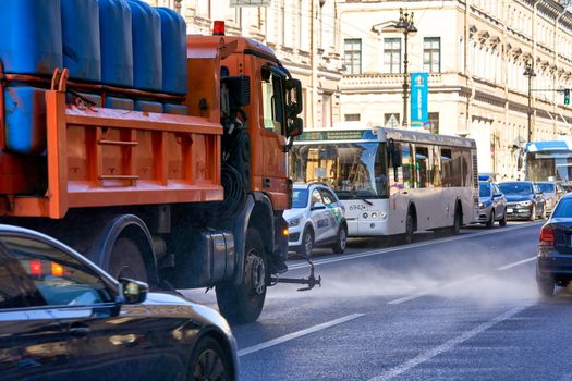 Saint Petersburg, Russia - June 10, 2021: Wet street cleaning using special equipment in Peterbuog