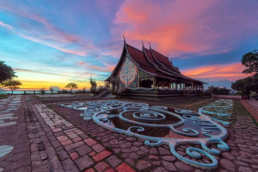 Twilight shot of Sirindhorn Wararam Phu Prao Temple is public Temple in Ubonrachatani, Thailand. Popularly known as the luminous temple Very Beautiful attractions.