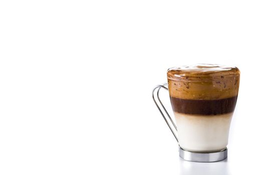 Creamy iced dalgona coffee isolated on white background