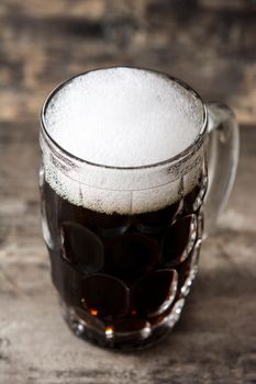 Traditional kvass beer mug on wooden table