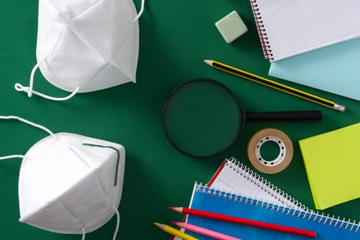 Assorted of school supplies and protective face mask Back to school concept