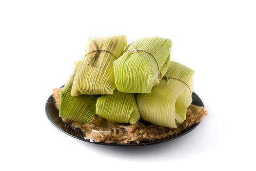 Mexican corn and chicken tamales isolated on white background