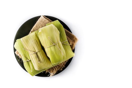 Mexican corn and chicken tamales isolated on white background.