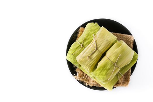 Mexican corn and chicken tamales isolated on white background.