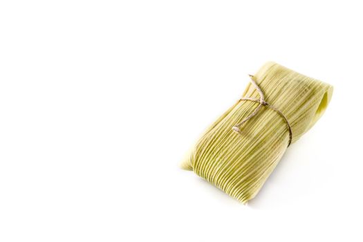 Mexican corn and chicken tamales isolated on white background.