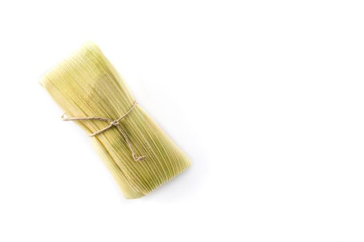 Mexican corn and chicken tamales isolated on white background.