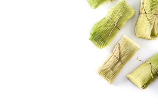 Mexican corn and chicken tamales isolated on white background