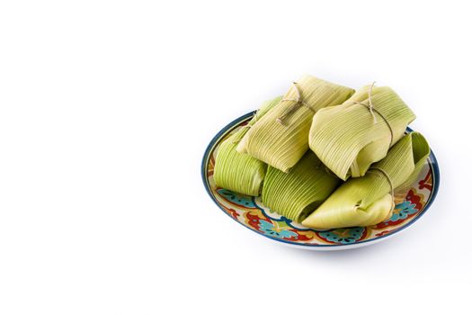 Mexican corn and chicken tamales isolated on white background