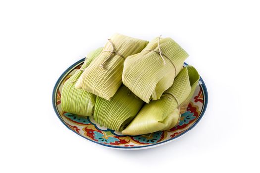 Mexican corn and chicken tamales isolated on white background