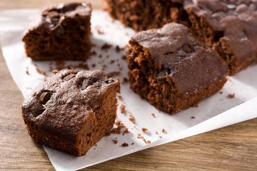 Delicious chocolate cake on wooden table