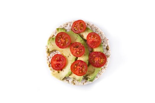 Puffed rice cake with tomatoes and avocado isolated on white background