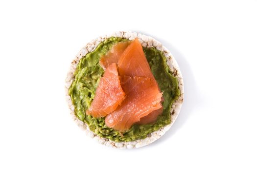 Puffed rice cake with guacamole and salmon isolated on white background